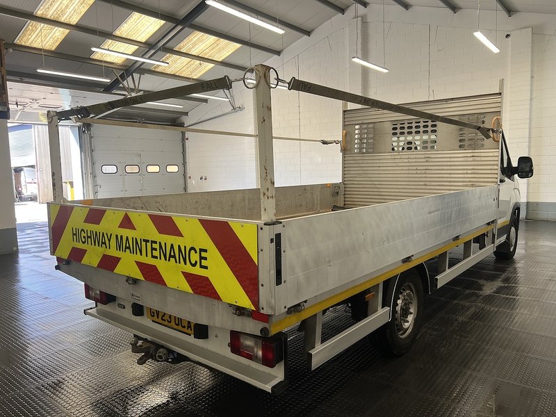 2023 Maxus Deliver 9 Dropside Van — rear three-quarter view