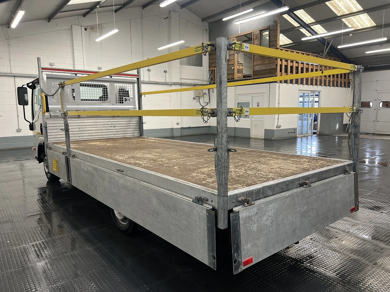 2023 Isuzu Grafter Dropside Van — rear three-quarter view