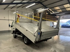 2023 Fuso Canter Tipper Van — rear three-quarter view